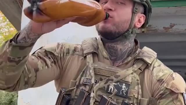 Coalition soldiers eat breakfast under fire