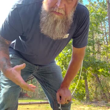 Using a grappling hook to clear a damaged tree from the hurricane — It Worked!