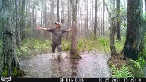 Singing in the rain in the swampy Florida Everglades.