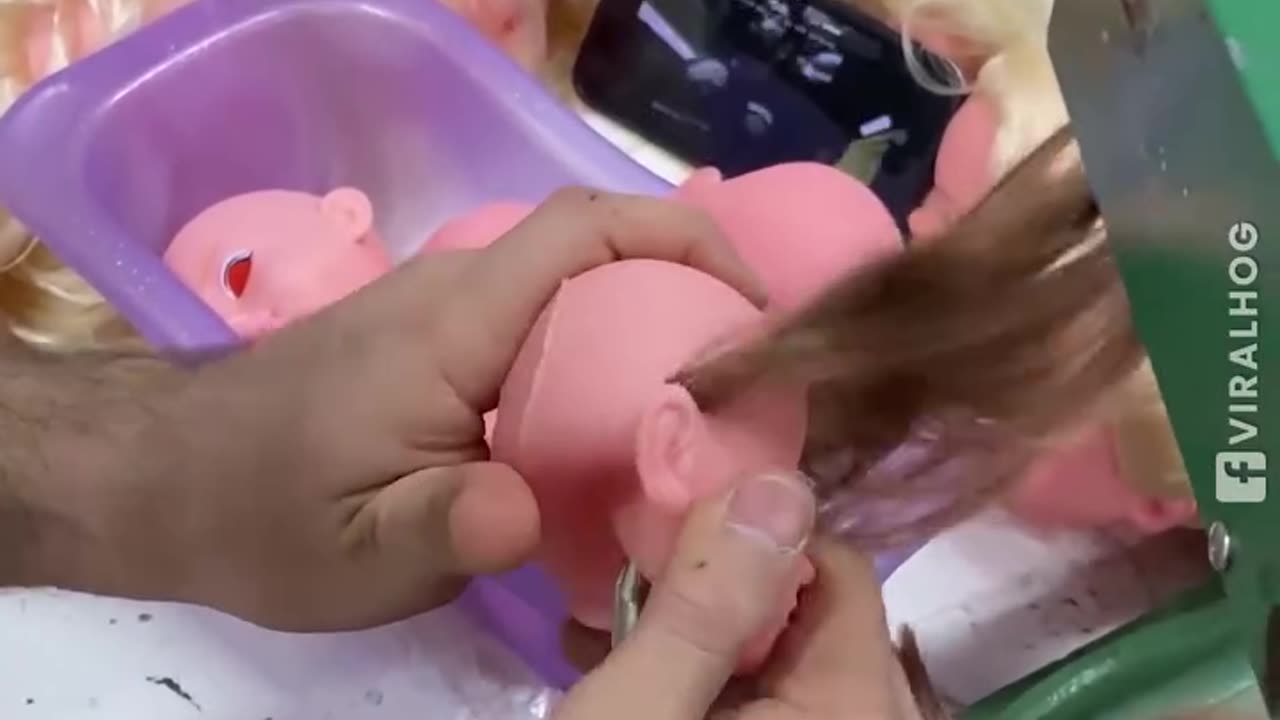 The process of sewing doll hair!.hd