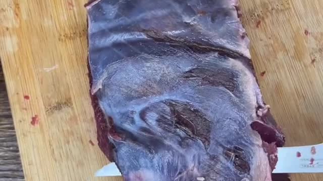 Cleaning up a bottom round roast from a deer