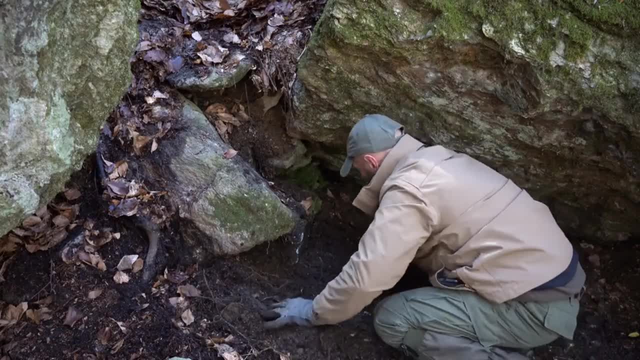 Four excavated shelter.Building underground bunker.Earth hut. primiti