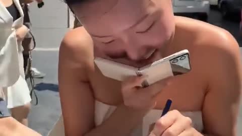 Mamamoo Hwasa using Samsung flip phone as a mask😂😭