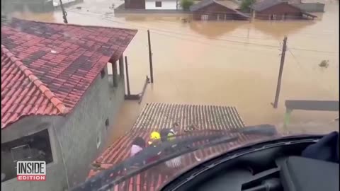 Dramatic Helicopter Rescue of Families Trapped on Rooftops