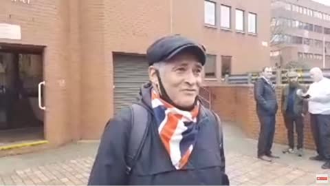 TOMMY ROBINSON SUPORTER OUT SIDE LUTON COURT