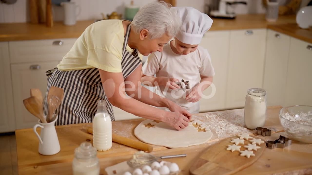 Grandmother cook together in kitchen.