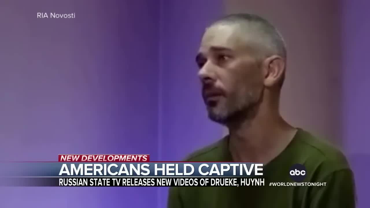 AMERICANS HELD CAPTIVE RUSSIAN STATE TV RELEASES NEW VIDEOS OF DRUEKE, HUYNH