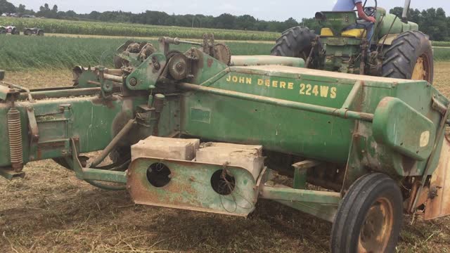 John Deere 630 pulling a JD 224 Baler