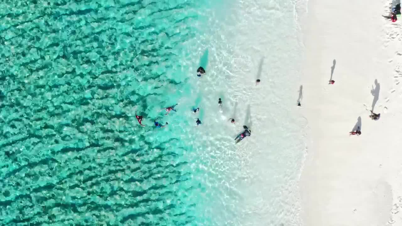 Beach front with children playing