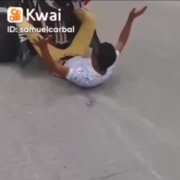 Quad bike doing a wheelie, passanger burns his ass