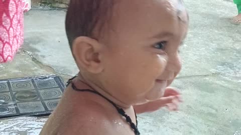 Indian children play in rain