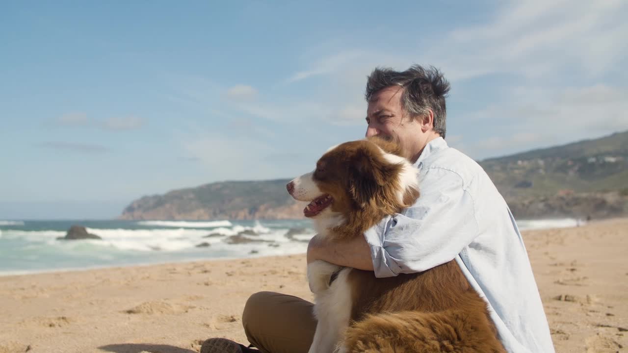 Man Hugging His Dog