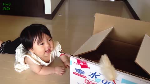 Asian baby get entertained and makes her happy