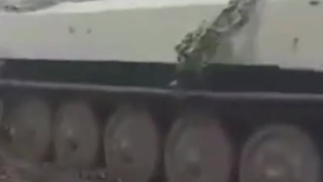 A Ukrainian MT-LB Tank Pulling A Captured Russian 2S3 Akatsiya