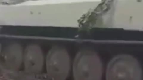 A Ukrainian MT-LB Tank Pulling A Captured Russian 2S3 Akatsiya