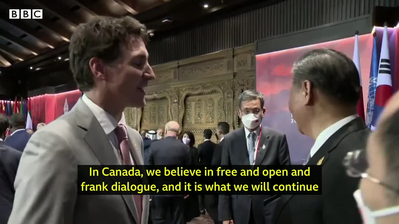 China and Canada leaders caught having tense exchange on camera - BBC News