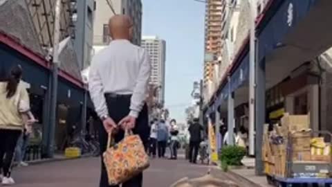 Man Takes His Huge Pet African Tortoise for Walk on Streets of Tokyo