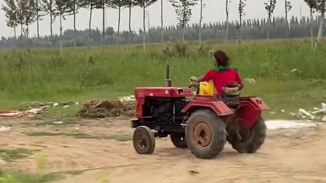 What is this man going to do with the tractor?