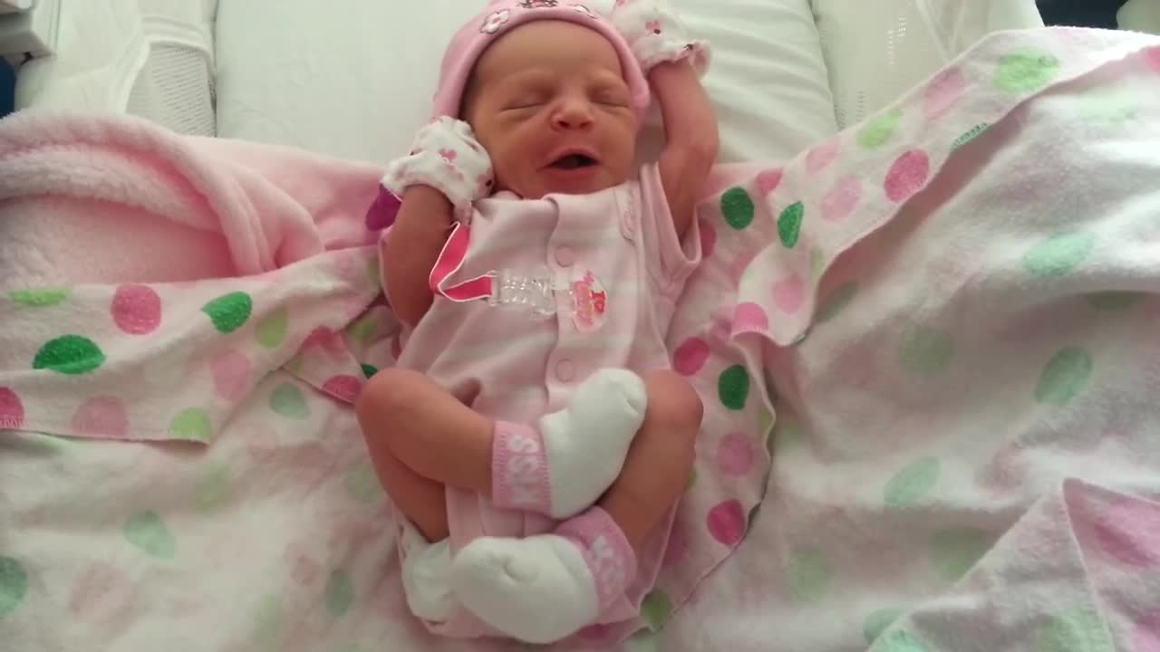 Newborn baby woke up early and stretched