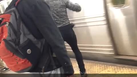 It's not easy man guy punches subway train on station