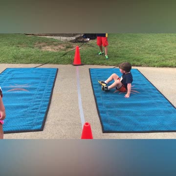 Adorable Little Boy Hilariously Struggles To Crawl Across Finish Line
