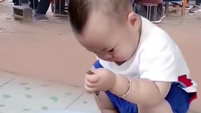 small child is surprised when playing fish