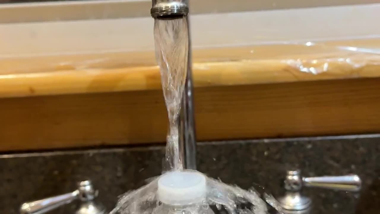 Laminar Flow Creates Water Bottle Waterfall