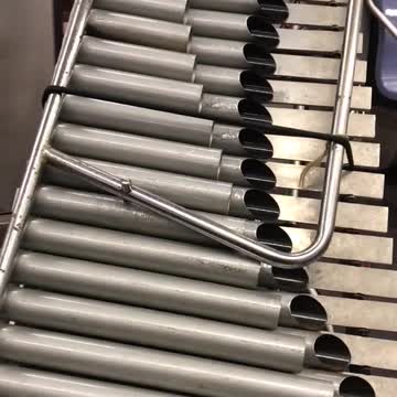 Guy dragging pipes out of subway door