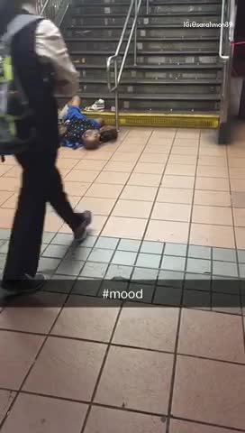 Mood man laid out bottom of stairs