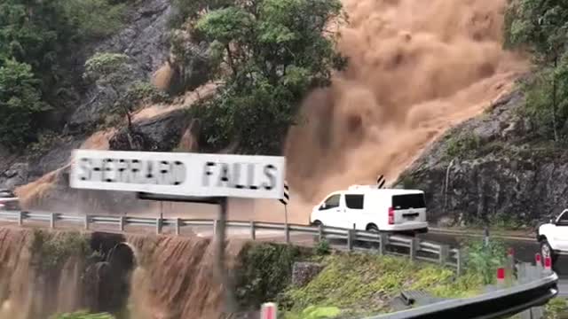 Flooding Waterfall Threatens Bridge