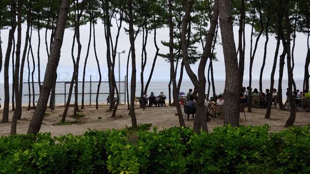 Time lapse view of the beach with relaxing people