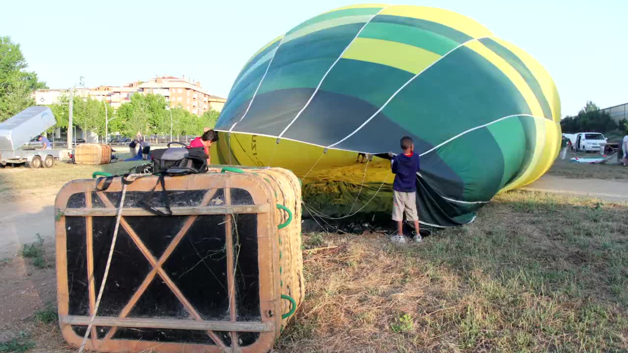People inflating a hot air balloon