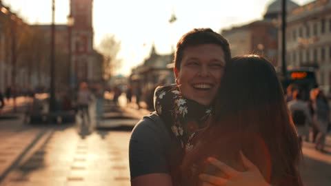 Joyful lovers hugging