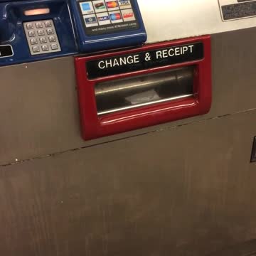 Rat crawls inside atm change and receipt slot, tail sticking out