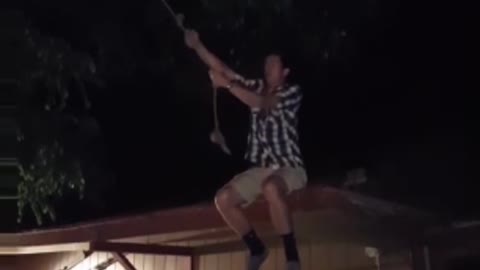 Guy roof rope swing lands on butt
