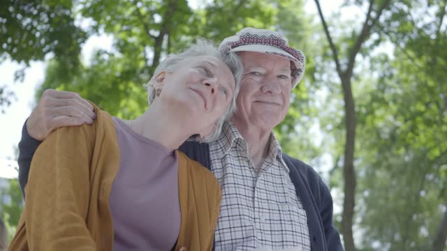 Cute old couple in a park.