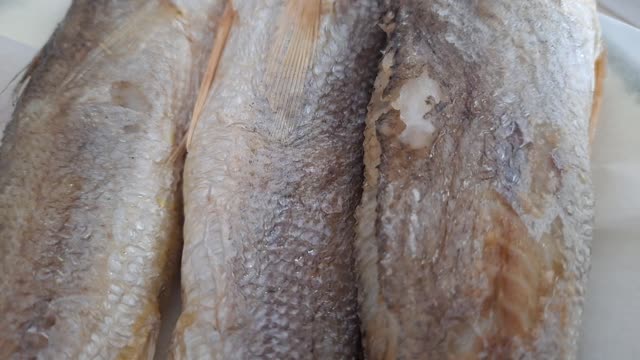 Grilled small dried yellow corvina.
