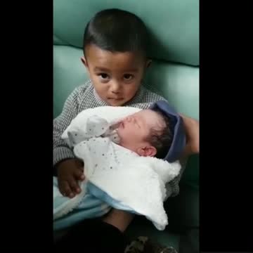 Emotional big sister meets baby brother for the first time
