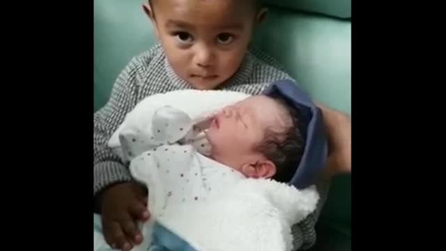 Emotional big sister meets baby brother for the first time