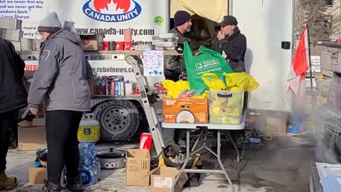 Participants of the Freedom Convoy preparing meals for the homeless in Ottawa