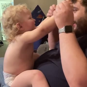 Dad & baby playing a learning game