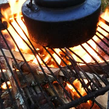 Brewing coffie on fire.