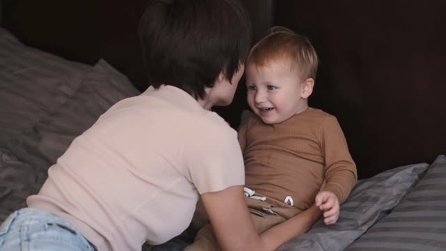 Cute baby and mother play