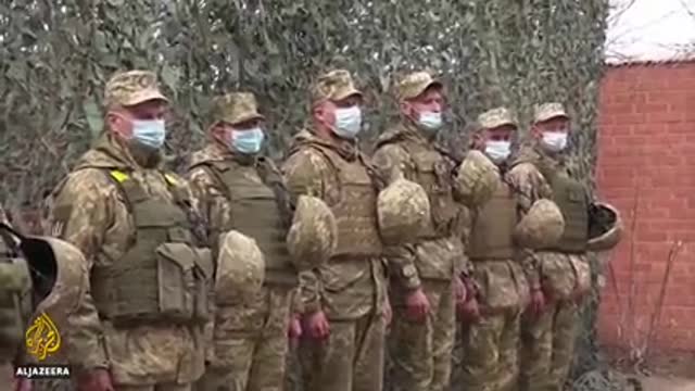 Merkel urges Putin to pull troops back from Ukraine border