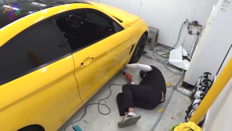 Process Of Turning Old BMW Into New Yellow Car. Korean Car Wrapping Technician