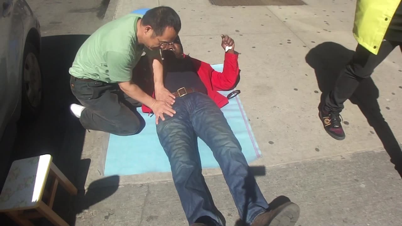 Luodong Briefly Massages Elderly Black Man's Leg