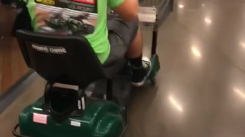 Music green shirt broken arm rides mobility scooter