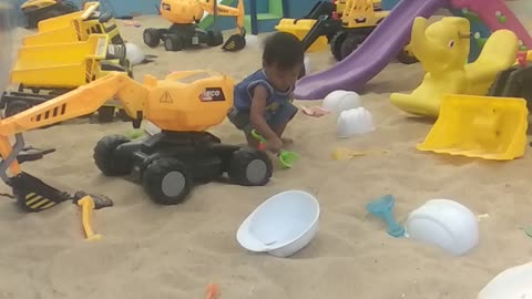 little akai playing in the sand 2