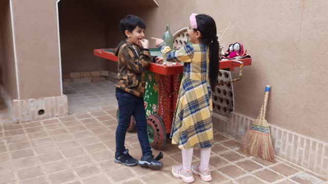 Pomegranates eat two playful children