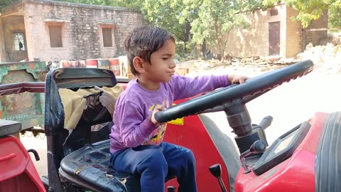 Kids drive tractor